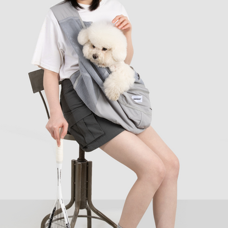 UrbanTrail Breathable Pet Sling Bag carrying small dog, comfortable safe travel carrier