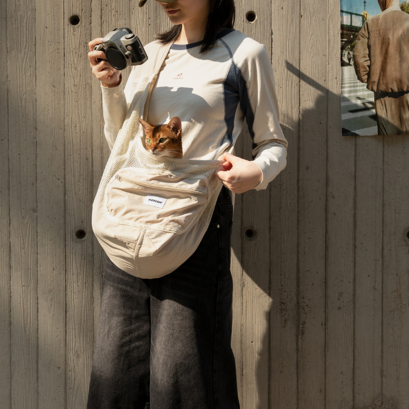 UrbanTrail breathable pet sling bag with cat inside, comfortable secure pet carrier for travel