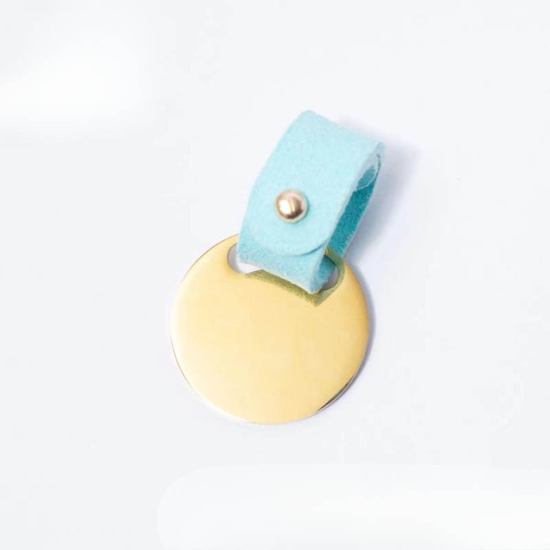 Blue custom suede pet ID tag, soft leather strap with metal snap closure.