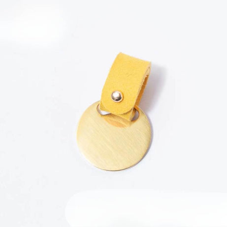 Yellow custom suede pet ID tag, soft leather strap with metal snap closure.