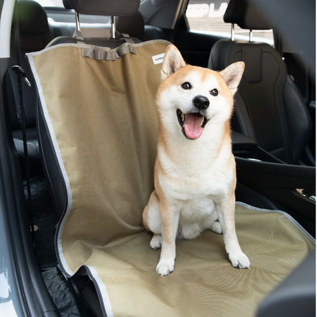 Happy Shiba Inu on urbanTrail multifunctional dog car seat protector, safeguarding car interior during travel.