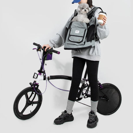 UrbanTrail multifunctional pet front carrier bag with small dog, ideal for bike rides and daily outings.