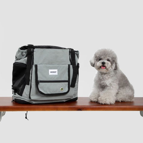 UrbanTrail Multifuncational Pet Travel Front Carrier Bag for dogs - Gray with black accents, shown beside happy small dog ...