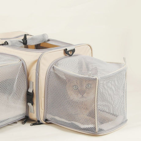 Traveler Expandable Pet Carrier Bag - Air Approved: Beige expandable carrier with mesh panels and small pet inside