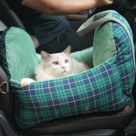 Green and blue tartan pet car seat with cat, secure and comfortable for pet travel